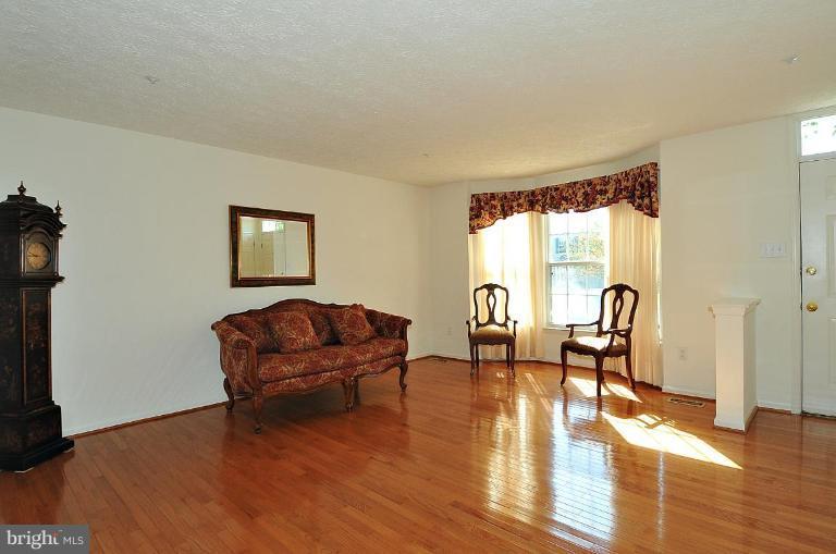 6116 Starburn Path Columbia, MD 21045 - Photo 14 of 18 a living room with furniture and a window