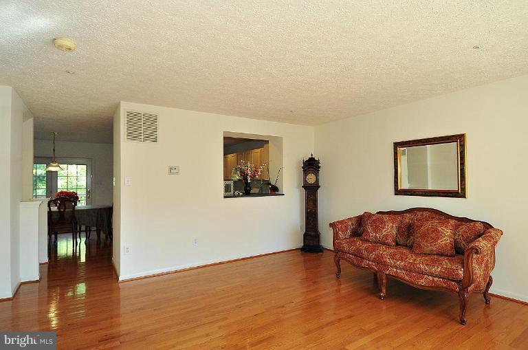 6116 Starburn Path Columbia, MD 21045 - Photo 15 of 18 a living room with furniture and a wooden floor