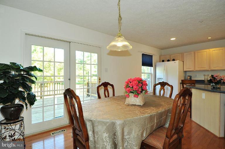 6116 Starburn Path Columbia, MD 21045 - Photo 3 of 18 a view of a dining room with furniture window and outside view