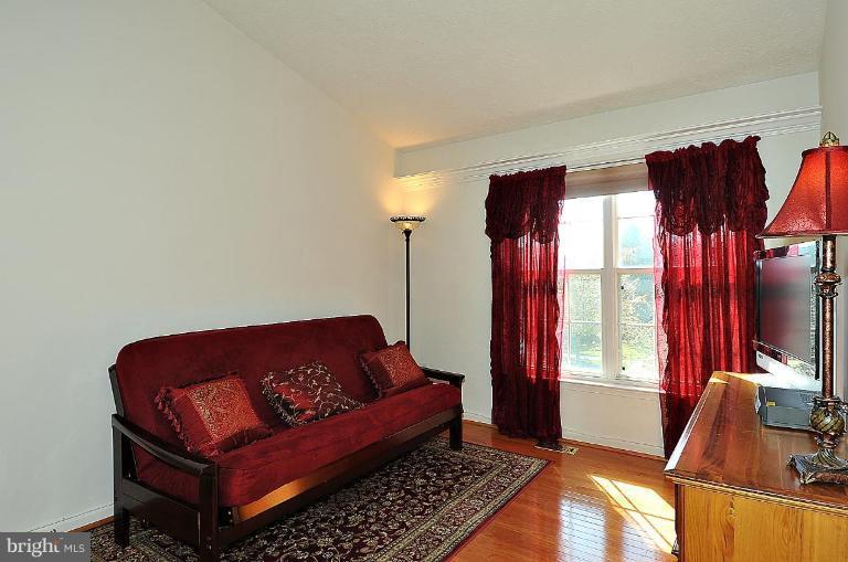 6116 Starburn Path Columbia, MD 21045 - Photo 8 of 18 a living room with furniture and a window