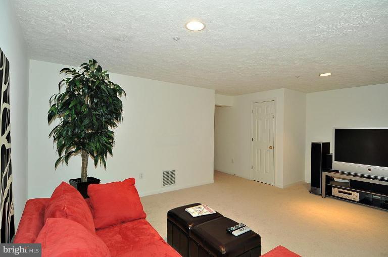 6116 Starburn Path Columbia, MD 21045 - Photo 10 of 18 a living room with furniture and a flat screen tv