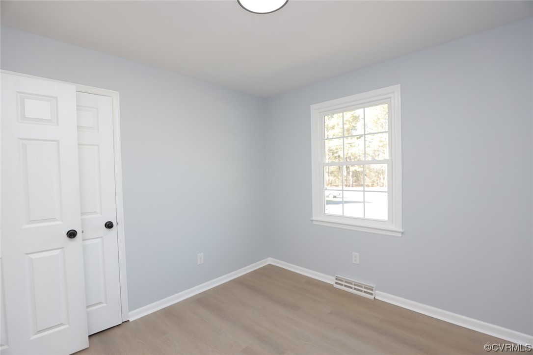 4321 Tatum Road Disputanta, VA 23842 - Photo 29 of 43 an empty room with windows