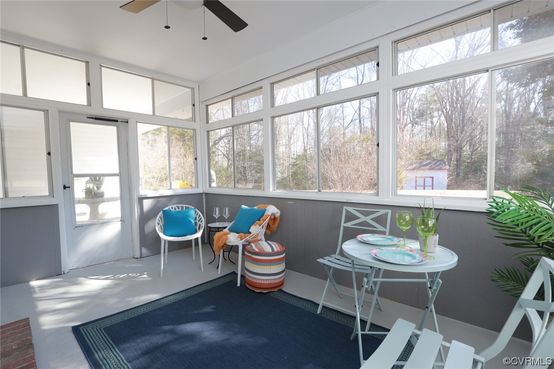 4321 Tatum Road Disputanta, VA 23842 - Photo 35 of 43 a dining room with furniture a window and a potted plant