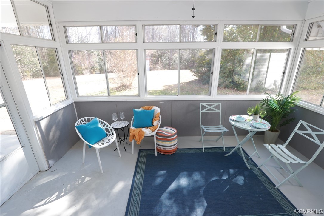 4321 Tatum Road Disputanta, VA 23842 - Photo 36 of 43 a dining room with furniture and a large window