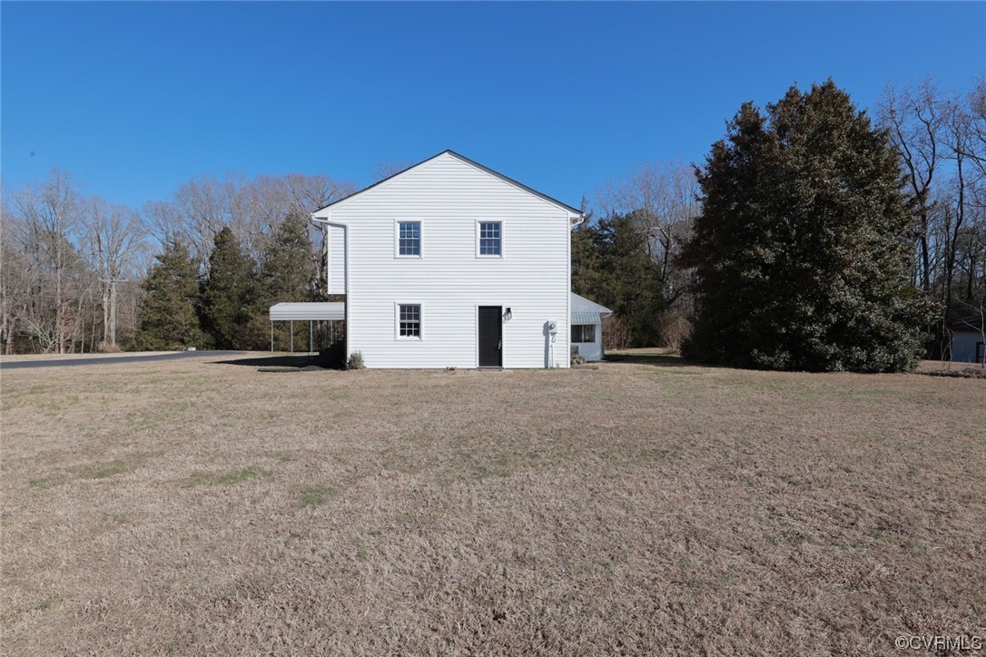 4321 Tatum Road Disputanta, VA 23842 - Photo 42 of 43 a view of white house with a yard