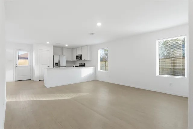 a view of a kitchen with a sink cabinets and a window