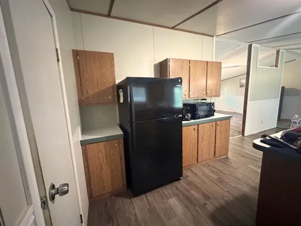 a bedroom with a bed and a night stand