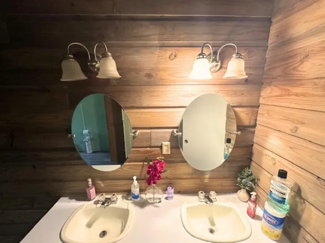 a room with a wooden floor and chairs