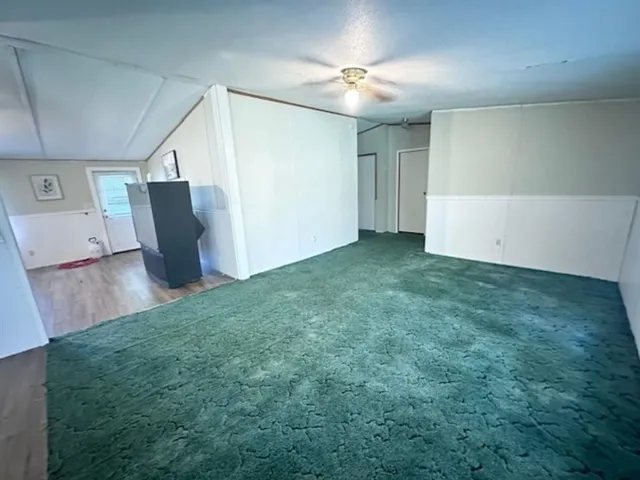 a kitchen with a refrigerator and a stove