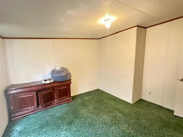 a bedroom with a bed and a furniture