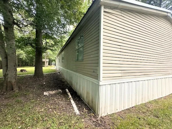 a swimming pool with trees in the background