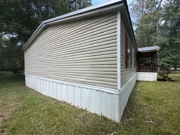 a view of a backyard with a small cabin