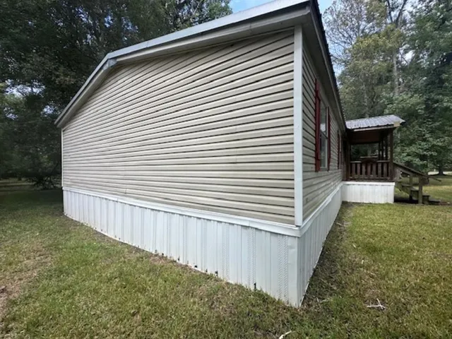 a view of a backyard with a small cabin
