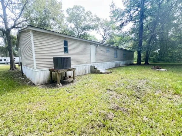 a view of outdoor space with deck and yard