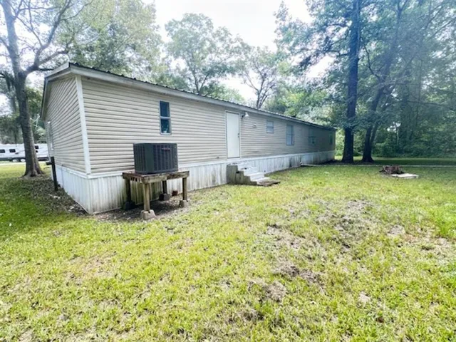 a view of outdoor space with deck and yard