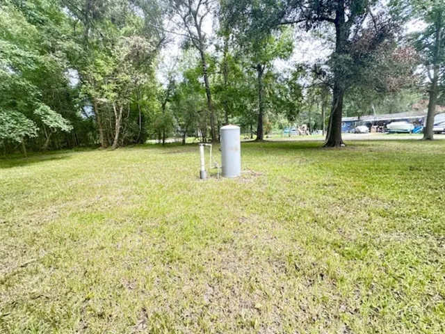 a view of lake with sunset in background