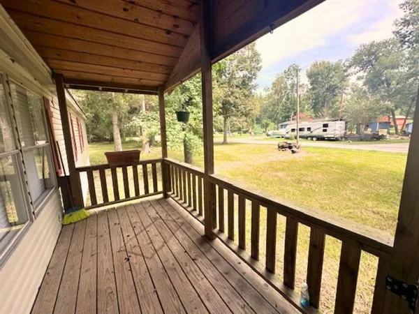 a view of balcony with wooden floor