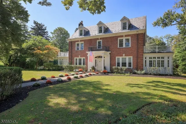a view of a house with swimming pool yard and patio