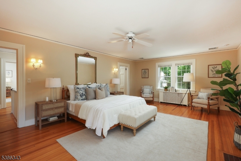 15 Georgian Road Morristown, NJ 07960 - Photo 15 of 44 a bedroom with a bed couch and a large window
