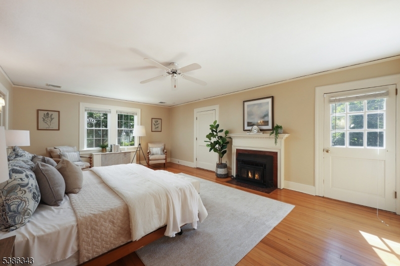 15 Georgian Road Morristown, NJ 07960 - Photo 16 of 44 a bedroom with a bed and a fireplace