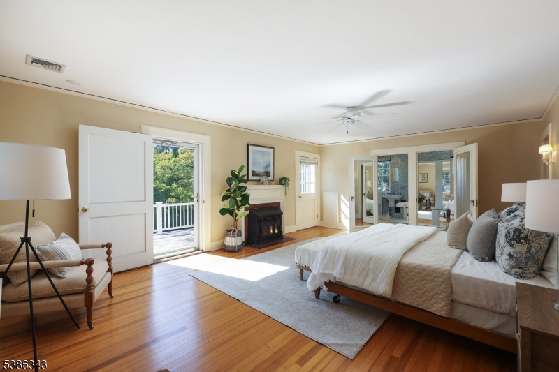 15 Georgian Road Morristown, NJ 07960 - Photo 17 of 44 a bedroom with a bed couch and three windows