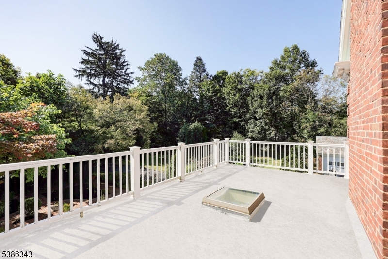 15 Georgian Road Morristown, NJ 07960 - Photo 18 of 44 a view of a wooden deck with a fence