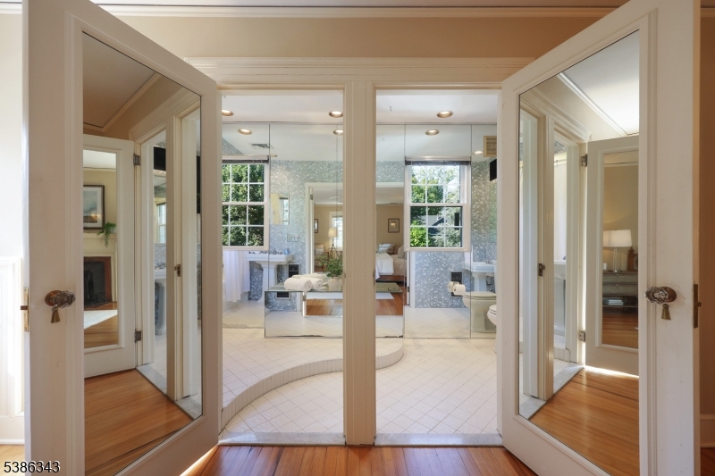 15 Georgian Road Morristown, NJ 07960 - Photo 19 of 44 a view of a hallway with dining room and furniture