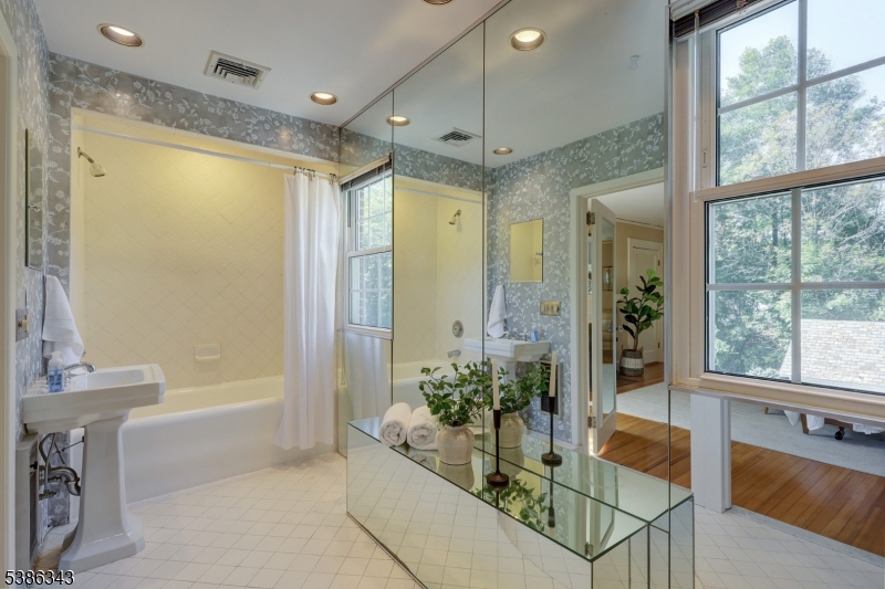 15 Georgian Road Morristown, NJ 07960 - Photo 20 of 44 a spacious bathroom with a tub shower and windows
