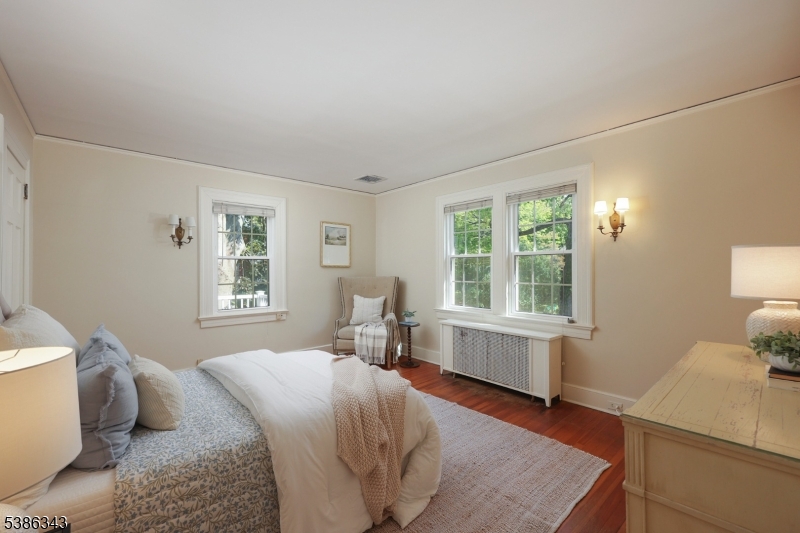 15 Georgian Road Morristown, NJ 07960 - Photo 24 of 44 a bedroom with a bed and wooden floor