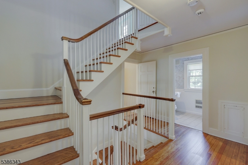 15 Georgian Road Morristown, NJ 07960 - Photo 26 of 44 a view of staircase with wooden floor and white walls