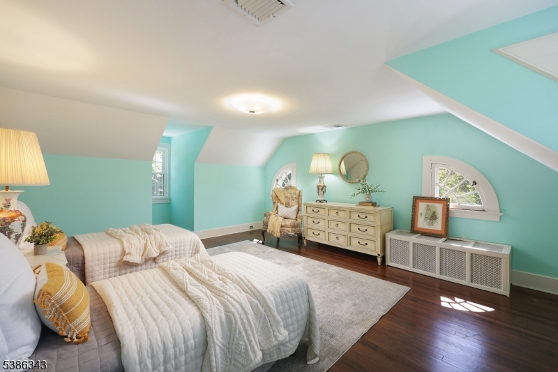 15 Georgian Road Morristown, NJ 07960 - Photo 27 of 44 a bedroom with a bed wooden floor and window