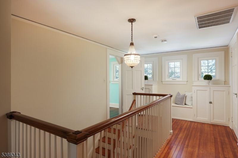 15 Georgian Road Morristown, NJ 07960 - Photo 30 of 44 a view of a hallway with wooden floor and staircase