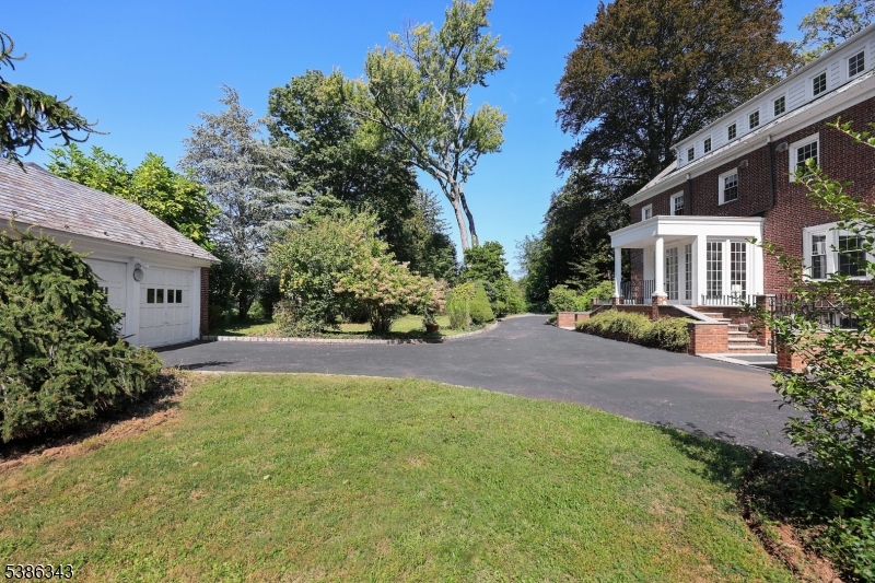 15 Georgian Road Morristown, NJ 07960 - Photo 35 of 44 a front view of a house with a yard and trees