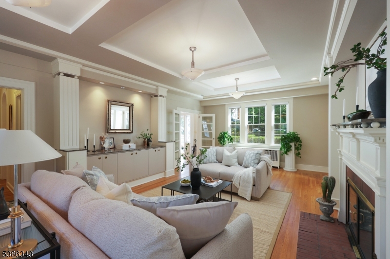 15 Georgian Road Morristown, NJ 07960 - Photo 5 of 44 a living room with furniture a fireplace and a chandelier