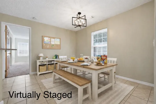 a kitchen with a stove a refrigerator and a sink