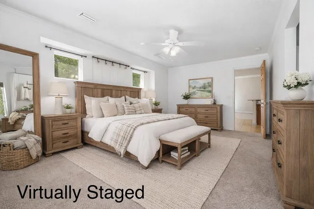 a spacious bedroom with a bed and a view of bathroom