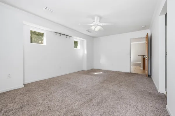 a view of an empty room with a window