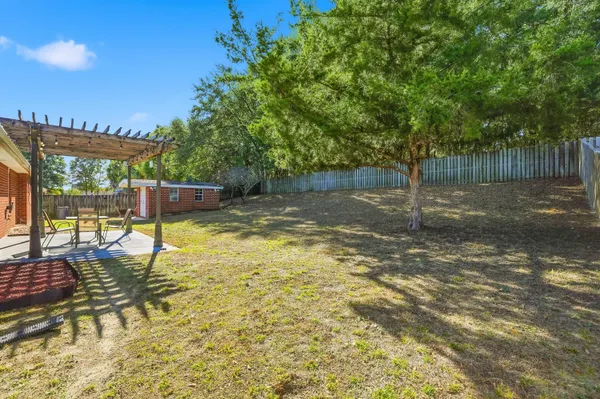 a swimming pool with some trees in the background