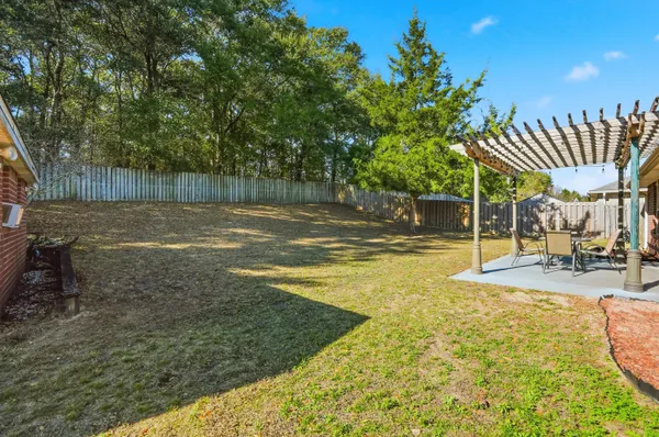 a view of a backyard with swimming pool