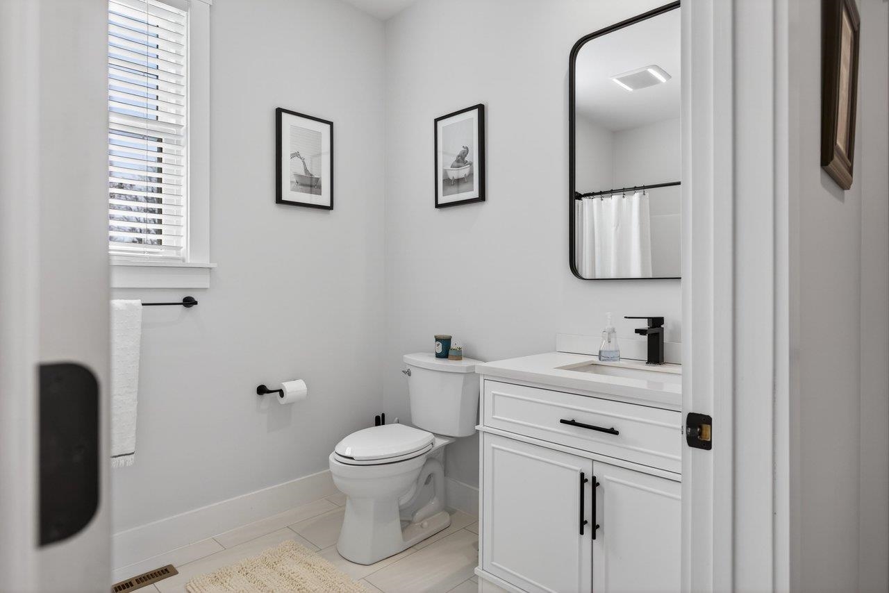 475 Beauford Road Harrisonburg, VA 22801 - Photo 42 of 75 a bathroom with a toilet sink vanity and mirror