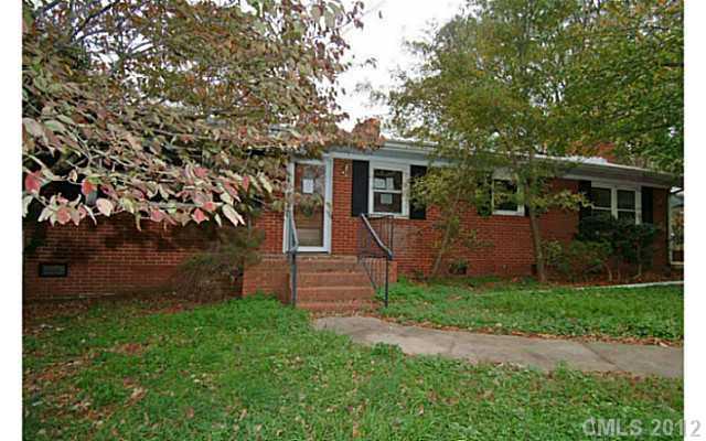 309 Culpepper Street Monroe, NC 28112 - Photo 1 of 9 front view of a house with a yard