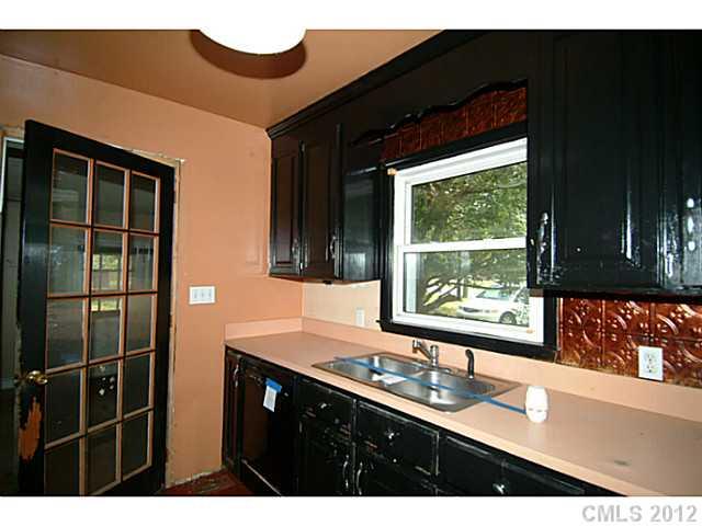309 Culpepper Street Monroe, NC 28112 - Photo 5 of 9 a bathroom with a sink and a large window