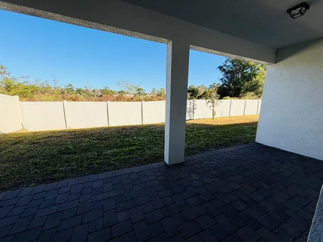 a view of a yard with an ocean view