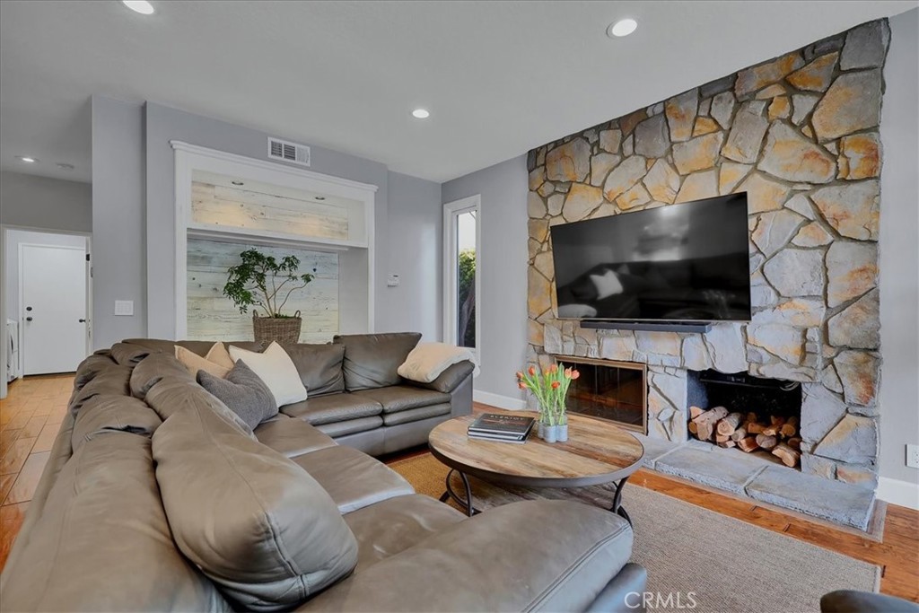 22 Colonial Irvine, CA 92620 - Photo 13 of 47 a living room with furniture and a flat screen tv