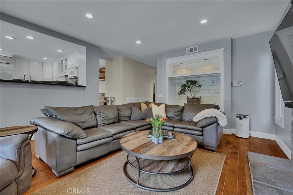 22 Colonial Irvine, CA 92620 - Photo 14 of 47 a living room with furniture and a wooden floor