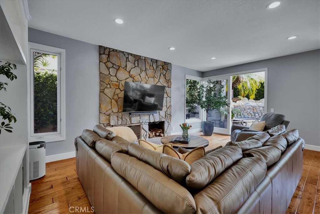 22 Colonial Irvine, CA 92620 - Photo 16 of 47 a living room with furniture and a flat screen tv