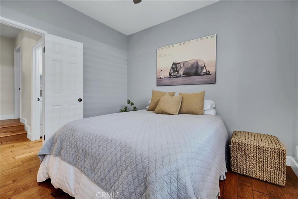 22 Colonial Irvine, CA 92620 - Photo 18 of 47 a bedroom with a bed and a painting on the wall