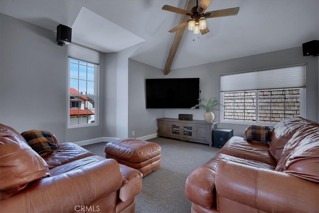 22 Colonial Irvine, CA 92620 - Photo 23 of 47 a living room with furniture and a flat screen tv
