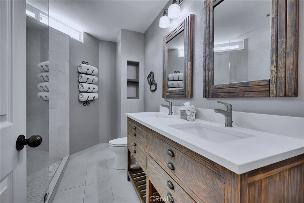 22 Colonial Irvine, CA 92620 - Photo 25 of 47 a bathroom with a sink and a mirror