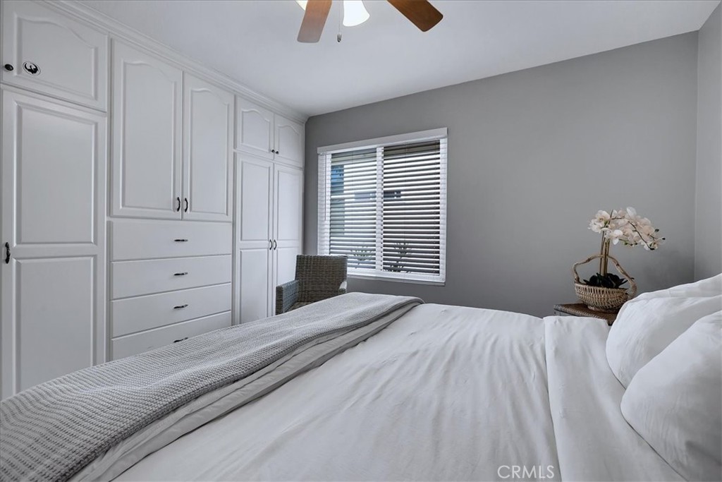 22 Colonial Irvine, CA 92620 - Photo 29 of 47 a bedroom with a bed and a window